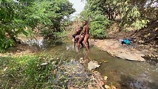 Curvy brown-skinned ebony at the stream