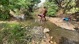 Curvy brown-skinned ebony at the stream