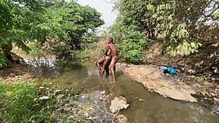 Curvy brown-skinned ebony at the stream