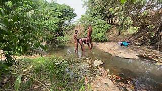 Curvy brown-skinned ebony at the stream