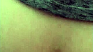 the milf rides the brown cock in a homemade interracial scene featuring big natural tits and passionate riding