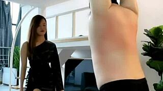 Chinese beautiful mistress Yihuan femdom whipping session with brutal boots and legs