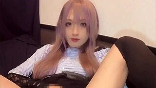 check out this cute pink-haired ladyboy playing with a vibrator in her ass