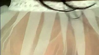 Beautiful brunette enjoys a relaxing massage with oil.