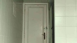 sexy guy casually shaving in black beach shorts