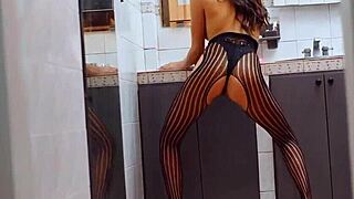 Sofia Torres in fishnet outfit posing seductively