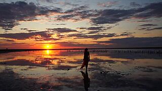 Walk on red sunset of elton salt lake