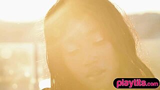 feeling sensual, petite ebony milf strips. exposes juicy round tits in pool