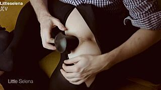 Deep anal fisting contrasts with black dress