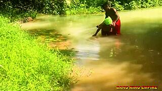 i'm fucking this african whore in the stream with my big dick