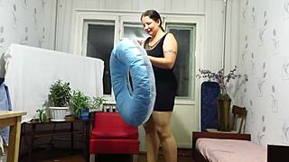 milf looner blows up beach circle balloons in fetish fun