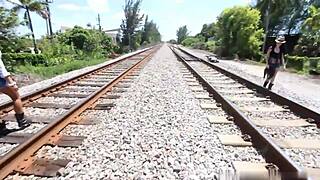 Woman sucks on the train tracks