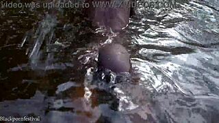 Attractive african village girl bathing in the river under the sun