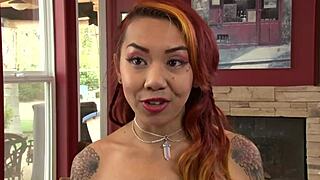 Asian lesbians kissing in the bathtub