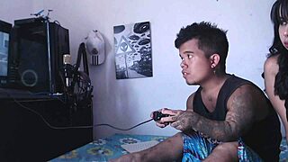 while the dwarf plays video games the horny stepsister arrives to play with his penis