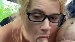 a woman with glasses on the street chats with a man casually