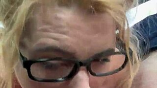 a woman with glasses on the street chats with a man casually