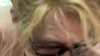 a woman with glasses on the street chats with a man casually