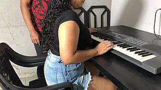 Curvy young Colombian in tight skirt flashes huge natural tits during hot dorm keyboard lessons