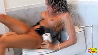 how do these lesbian brunettes fist each other's assholes over the toilet in heels?