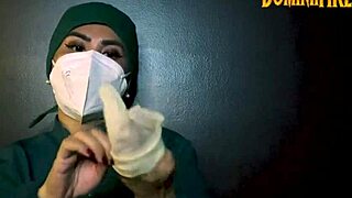 She slips on latex gloves to tease his fetish desires slowly