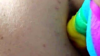 chubby brunette gapes ass on huge rainbow dildo deep