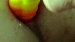 chubby brunette gapes ass on huge rainbow dildo deep