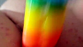 chubby brunette gapes ass on huge rainbow dildo deep