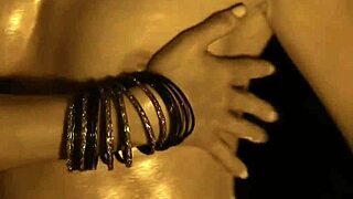 flames flicker as exotic dancer strips bare teasing her sensual curves