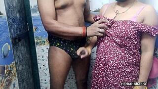 Horny Indian bhabhi jerks husband in bathroom till he blasts cumshot on her sexy blue panties