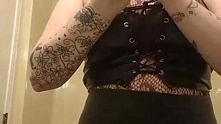 Chubby tattooed slut with huge natural tits gropes legs in bra while using lovesense on cam