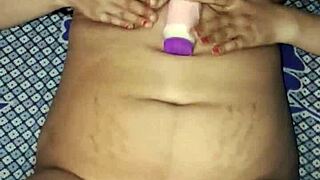 Indian bhabhi rams huge dildo deep in wet hairy pussy