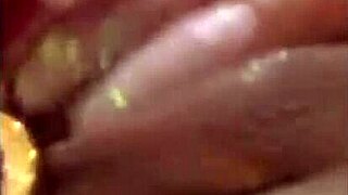 latina beauty masturbates wet pussy with dildo on bed