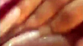 latina beauty masturbates wet pussy with dildo on bed