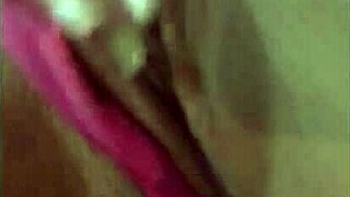 latina beauty masturbates wet pussy with dildo on bed