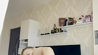 blonde babe hikes down her panties teasing round ass cheeks