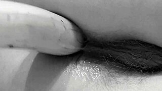 milf in stockings stuffs banana up hairy ass on floor?