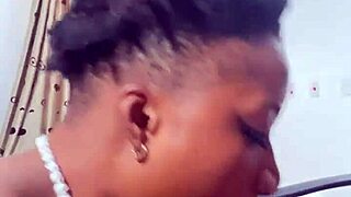 naija babe candy kneels to suck that massive black cock deep