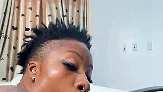 naija babe candy kneels to suck that massive black cock deep
