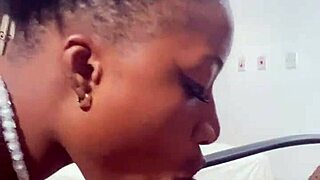 naija babe candy kneels to suck that massive black cock deep