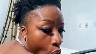 naija babe candy kneels to suck that massive black cock deep