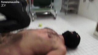 alice tramples masked slave joe on tennis balls under her feet