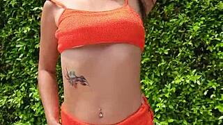 sexy babe flashes orange bikini in public outdoors