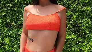 sexy babe flashes orange bikini in public outdoors