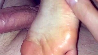 Girlfriend's soft feet get footjob cumshot jerkoff close-up