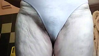 Granny Oma rams cucumber into hairy wet pussy