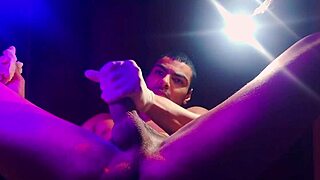 Sexy bodybuilder Mora Blue strokes monster cock with gloved handjob frenzy