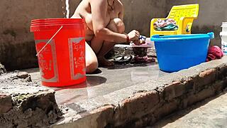 peeking at village bhabhi bathing outdoors with her huge tits and juicy pussy exposed