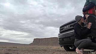 Amateur couple sneaks a public blowjob on big cock right by the road outside their hotel for watchers.