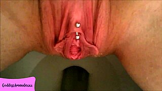 A casual peek at my shaved pierced pussy letting loose in the bathroom